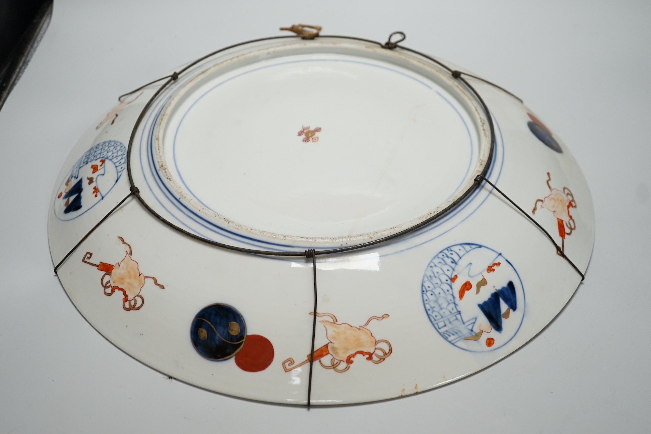 A Japanese Imari ‘dragon and phoenix’ charger, Meiji period, 46cm diameter